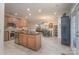 Spacious kitchen with granite countertops, stainless steel appliances, and a center island offering functionality at 11008 Round Rock Rd, Charlotte, NC 28277