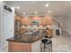 Kitchen island featuring granite countertops, pendant lighting, and seating, perfect for casual dining at 11008 Round Rock Rd, Charlotte, NC 28277