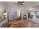 An open living room with vaulted ceiling, fan and an archway leading to the dining room at 11008 Round Rock Rd, Charlotte, NC 28277