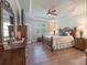 Spacious main bedroom features a trey ceiling, ceiling fan, and wood floors at 11008 Round Rock Rd, Charlotte, NC 28277
