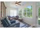 Bright sun room with paneled walls, ample windows, and comfortable seating at 11008 Round Rock Rd, Charlotte, NC 28277