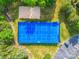 Aerial view of blue tennis courts, a sand volleyball court, and parking at 1103 Cooper Ln, Indian Trail, NC 28079