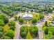 Aerial view showcasing neighborhood pool, tennis courts, mature trees, and well-maintained streets at 1103 Cooper Ln, Indian Trail, NC 28079