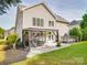Charming backyard with a pergola-covered seating area, well-maintained lawn, and large deck at 1103 Cooper Ln, Indian Trail, NC 28079