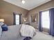 Comfortable bedroom with neutral colors, natural light, and accent decor at 1103 Cooper Ln, Indian Trail, NC 28079