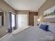 Cozy bedroom features natural light, ample closet space, and warm neutral paint at 1103 Cooper Ln, Indian Trail, NC 28079