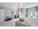 Bedroom featuring light teal walls, a chandelier, and carpeted floor at 1103 Cooper Ln, Indian Trail, NC 28079