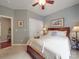 Comfortable bedroom featuring a ceiling fan, closet, and a light color scheme that creates a calming atmosphere at 1103 Cooper Ln, Indian Trail, NC 28079