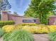 Welcoming brick entrance to Brandon Oaks with lush landscaping, mature trees, and clear community signage at 1103 Cooper Ln, Indian Trail, NC 28079