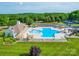 Beautiful community pool with splash features, a slide, lounging area, and clubhouse at 1103 Cooper Ln, Indian Trail, NC 28079