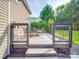 Inviting outdoor deck area with a dining set, umbrella, and privacy fencing at 1103 Cooper Ln, Indian Trail, NC 28079