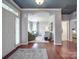 Inviting foyer with hardwood floors, arched doorway, and a view into the living room, creating a warm welcome at 1103 Cooper Ln, Indian Trail, NC 28079