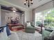 Inviting living room featuring hardwood floors, a large window with natural light, and neutral décor at 1103 Cooper Ln, Indian Trail, NC 28079