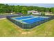 Well-maintained tennis courts with green and blue playing surfaces and a perimeter fence at 1103 Cooper Ln, Indian Trail, NC 28079