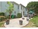Spacious backyard with patio, deck, green lawn, and lush landscaping at 11232 Tradition View Dr, Charlotte, NC 28269