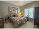 Cozy bedroom with neutral walls, bedside tables, and soft, natural light from the large window at 11232 Tradition View Dr, Charlotte, NC 28269