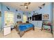 Bedroom with blue walls, ceiling fan, ceiling decorations and two windows at 11232 Tradition View Dr, Charlotte, NC 28269