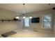 Bonus room with neutral paint, two windows, and light fixture - perfect for customizing as you desire at 11232 Tradition View Dr, Charlotte, NC 28269