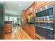 Kitchen boasts stainless appliances, granite counters, a gas cooktop, and a view to the breakfast nook at 11232 Tradition View Dr, Charlotte, NC 28269