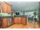 Spacious kitchen featuring granite countertops, stainless steel appliances, and views into the breakfast nook at 11232 Tradition View Dr, Charlotte, NC 28269