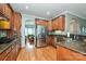 Well-equipped kitchen with stainless steel appliances, granite countertops, and wooden cabinets at 11232 Tradition View Dr, Charlotte, NC 28269