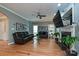 Comfortable living room with a fireplace, a ceiling fan, and hardwood floors at 11232 Tradition View Dr, Charlotte, NC 28269