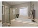 Luxurious main bath with soaking tub, separate shower and an abundance of natural light at 11232 Tradition View Dr, Charlotte, NC 28269