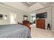 Bright main bedroom showing an ensuite bathroom and a TV area at 11232 Tradition View Dr, Charlotte, NC 28269