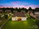 Expansive backyard featuring a well-maintained lawn, a wooden deck, and a fence at 1128 Rosecliff Dr, Marvin, NC 28173