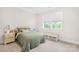Inviting bedroom featuring neutral walls, a comfortable bed, and ample natural light from a window at 1128 Rosecliff Dr, Marvin, NC 28173