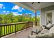Inviting covered deck with comfortable seating and views of a green yard under a bright blue sky at 1128 Rosecliff Dr, Marvin, NC 28173