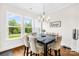 Inviting dining room with hardwood floors, ample natural light, and a view of the outdoor landscape at 1128 Rosecliff Dr, Marvin, NC 28173
