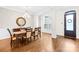 Elegant dining room with hardwood floors, chandelier, and stylish table setting for Gathering meals at 1128 Rosecliff Dr, Marvin, NC 28173