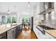 Modern kitchen with stainless steel appliances, granite countertops, and an open view to the dining area at 1128 Rosecliff Dr, Marvin, NC 28173