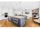 Spacious kitchen with a central island, stainless steel appliances, and open views to the living area at 1128 Rosecliff Dr, Marvin, NC 28173
