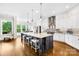Bright, open kitchen featuring a large island, stainless steel appliances, and modern finishes at 1128 Rosecliff Dr, Marvin, NC 28173
