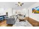Spacious open-concept living area with hardwood floors, and neutral decor, perfect for entertaining at 1128 Rosecliff Dr, Marvin, NC 28173
