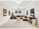 Spacious living room with a large sectional sofa, movie posters, and a popcorn machine for entertaining at 1128 Rosecliff Dr, Marvin, NC 28173
