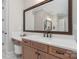Bathroom with a vanity area featuring a large framed mirror and a countertop with ample space at 1149 Grand Oak Dr, Waxhaw, NC 28173