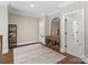 Cozy hallway featuring hardwood floors and a charming accent mirror and table at 1149 Grand Oak Dr, Waxhaw, NC 28173