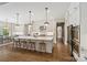 Modern kitchen features a large center island with seating and stainless steel appliances at 1149 Grand Oak Dr, Waxhaw, NC 28173