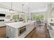 Bright, open kitchen featuring a large island with marble countertops and modern appliances at 1149 Grand Oak Dr, Waxhaw, NC 28173