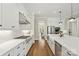 Bright kitchen boasts a large island, stainless steel appliances, and white marble countertops at 1149 Grand Oak Dr, Waxhaw, NC 28173