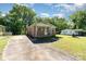 A charming one-story brick house with a covered front porch and a large concrete driveway at 1214 Short St, Salisbury, NC 28144