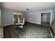 Spacious living room featuring vintage flooring, a light fixture, and ample natural light from the windows at 1224 Bailey St, Albemarle, NC 28001