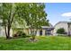 Lush backyard featuring a well-maintained lawn, mature trees, and an inviting patio area at 1244 Saint Johns Ave, Matthews, NC 28104