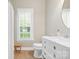 Bathroom featuring a white vanity with marble countertop, modern fixtures, and tiled flooring at 1244 Saint Johns Ave, Matthews, NC 28104
