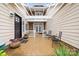 Inviting courtyard with a decorative pergola, stone accents, and comfortable seating for relaxation at 1244 Saint Johns Ave, Matthews, NC 28104
