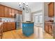 Bright kitchen featuring stainless steel appliances, a center island, and access to the outdoors through French doors at 1244 Saint Johns Ave, Matthews, NC 28104