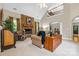 Spacious living room with vaulted ceilings, a stone fireplace, and large windows with natural light at 1244 Saint Johns Ave, Matthews, NC 28104